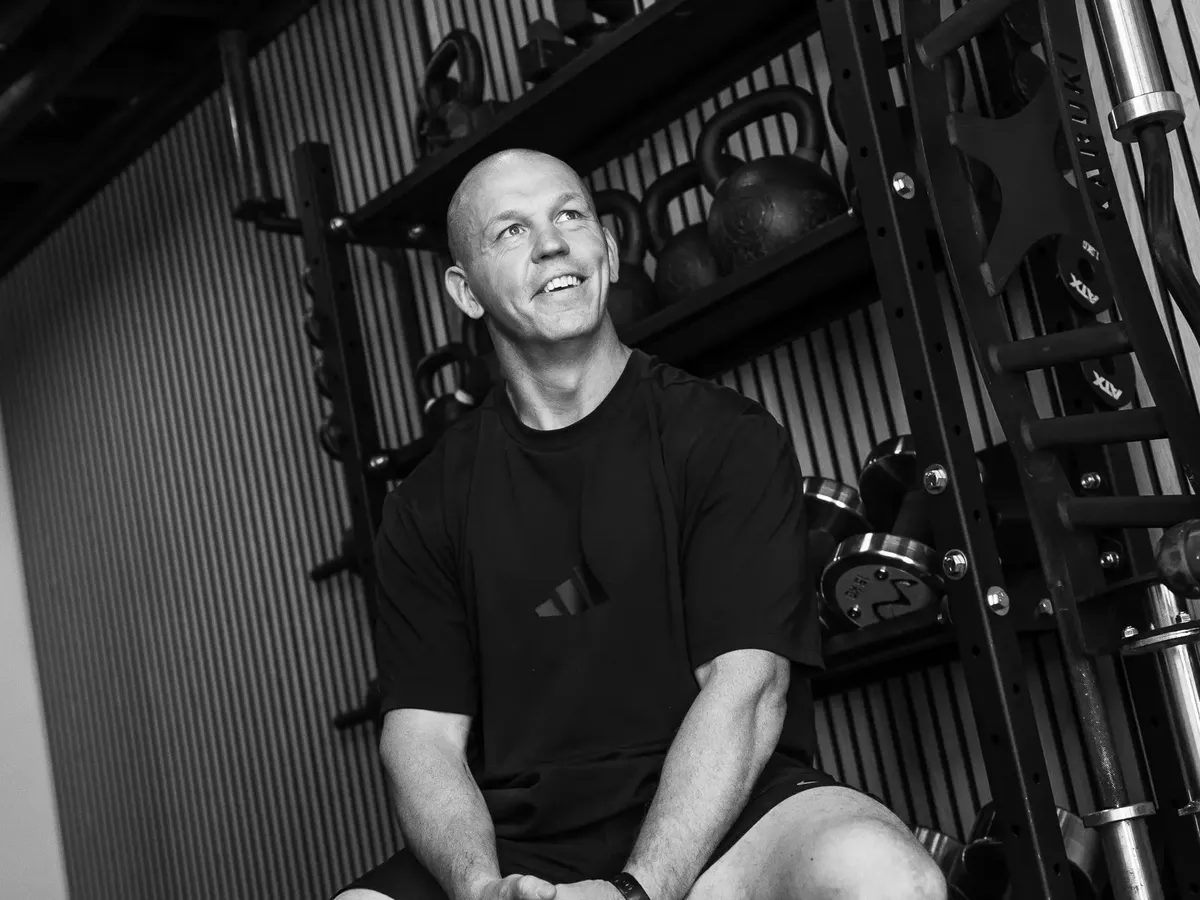 Gill smiling in his private gym